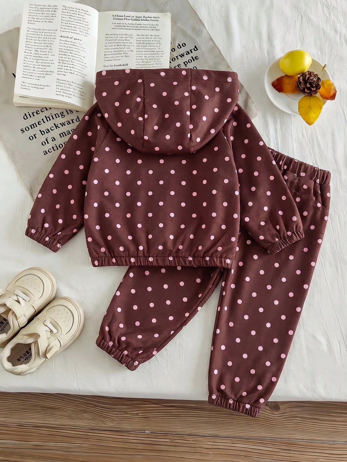 Girls Hooded Two Pieces Tracksuit In Brown With Pink Polka Dots. Full-Zip Hooded Jacket And Cuffed Jogger Pants Decorated With Pink Ribbons And Bows.
