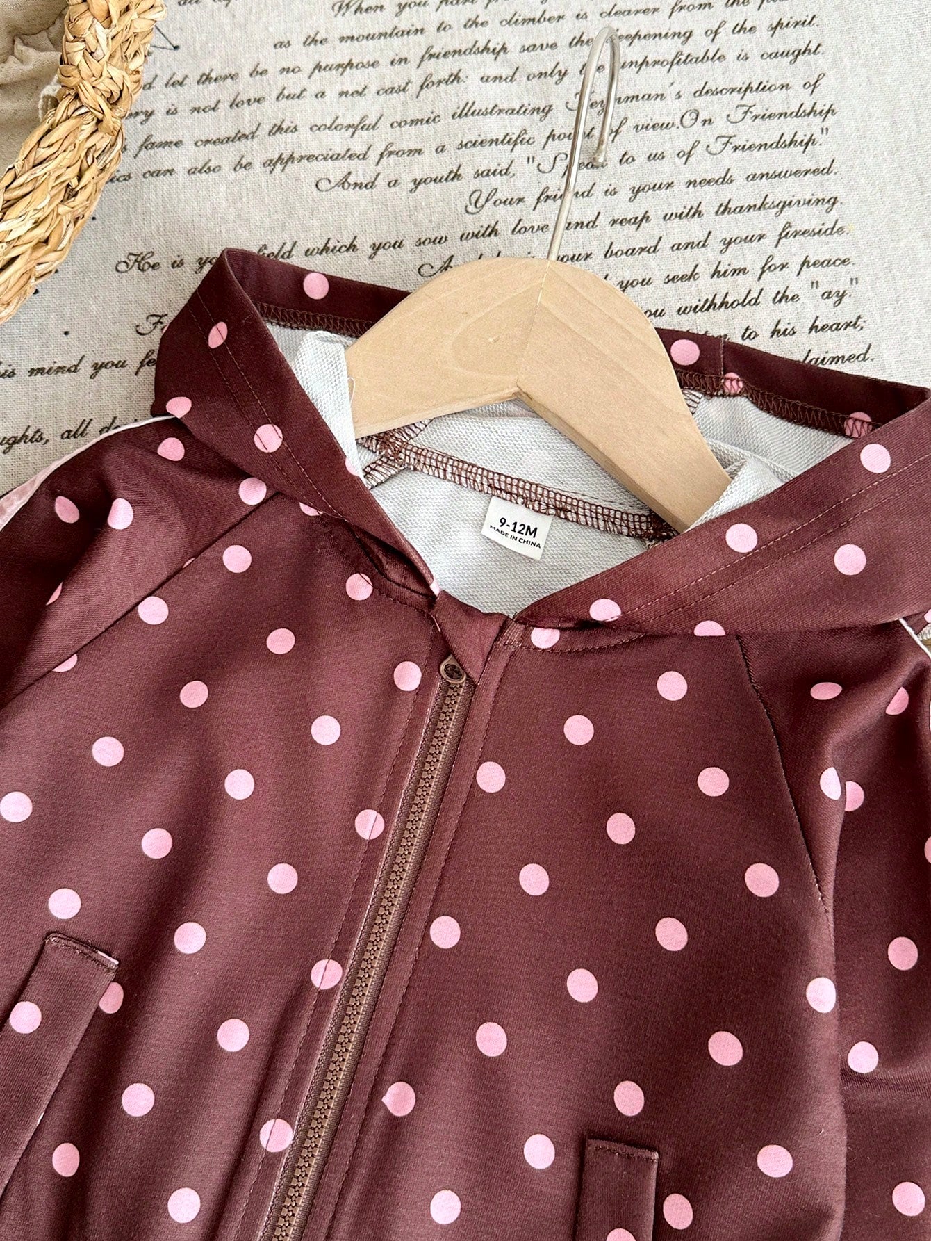 Girls Hooded Two Pieces Tracksuit In Brown With Pink Polka Dots. Full-Zip Hooded Jacket And Cuffed Jogger Pants Decorated With Pink Ribbons And Bows.